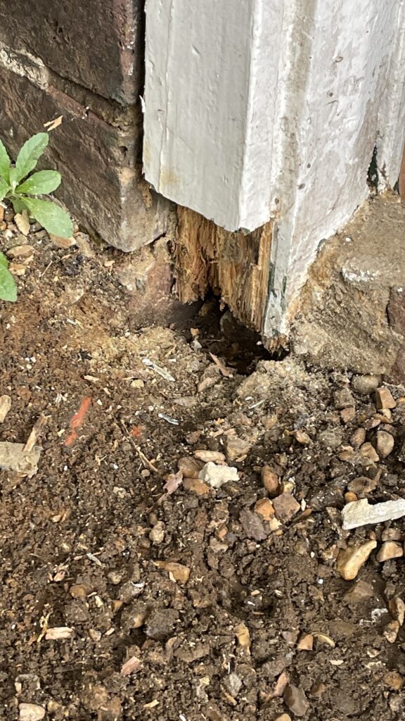 Rot at the bottom of the frame posts