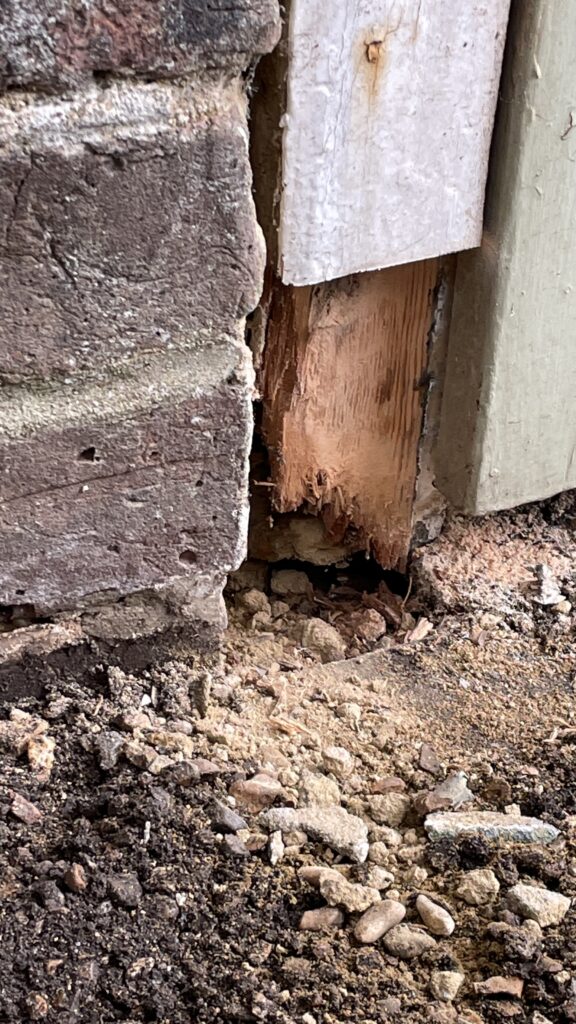 Rot at the bottom of the frame posts